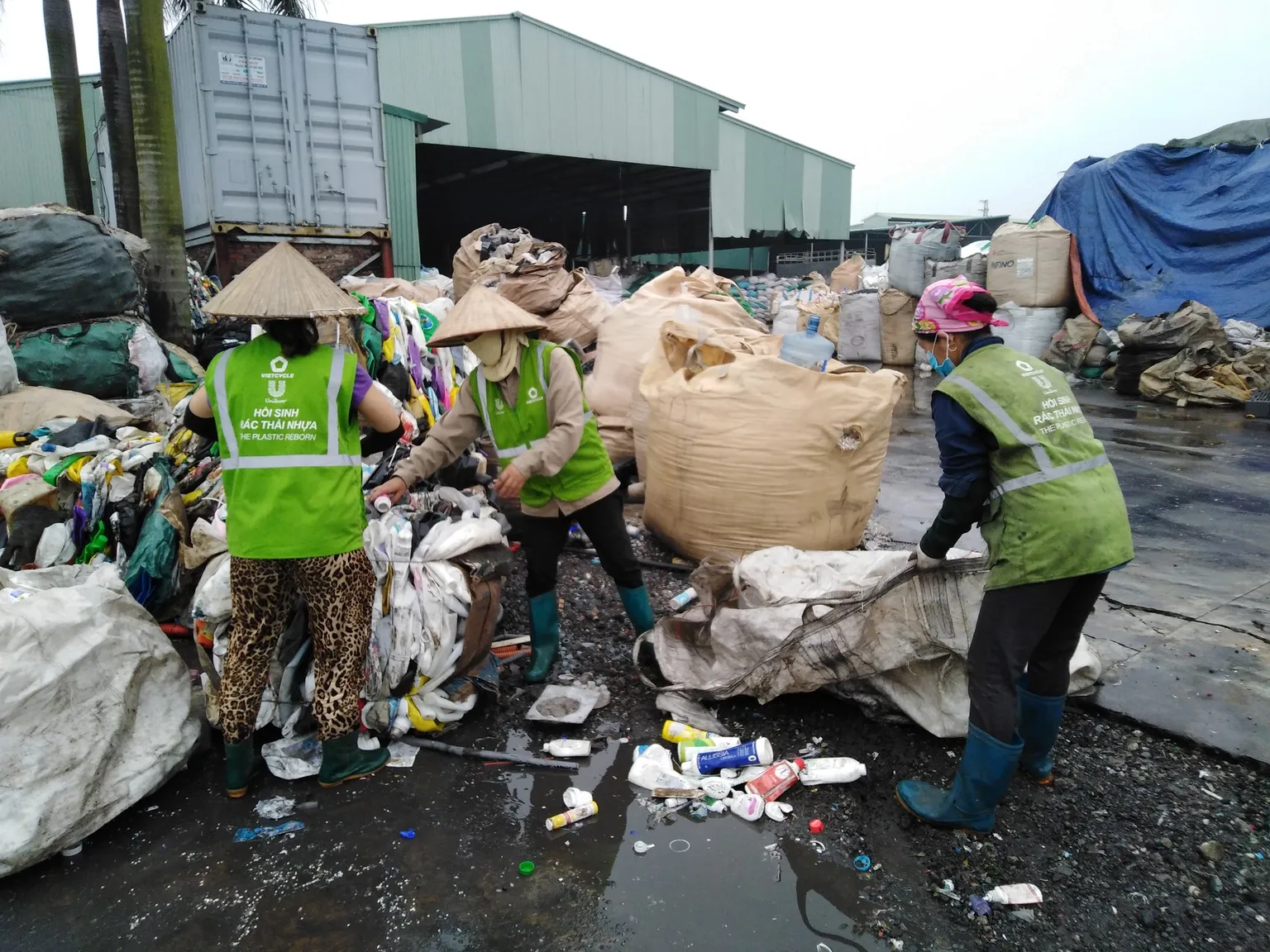 People sorting through waste to sell