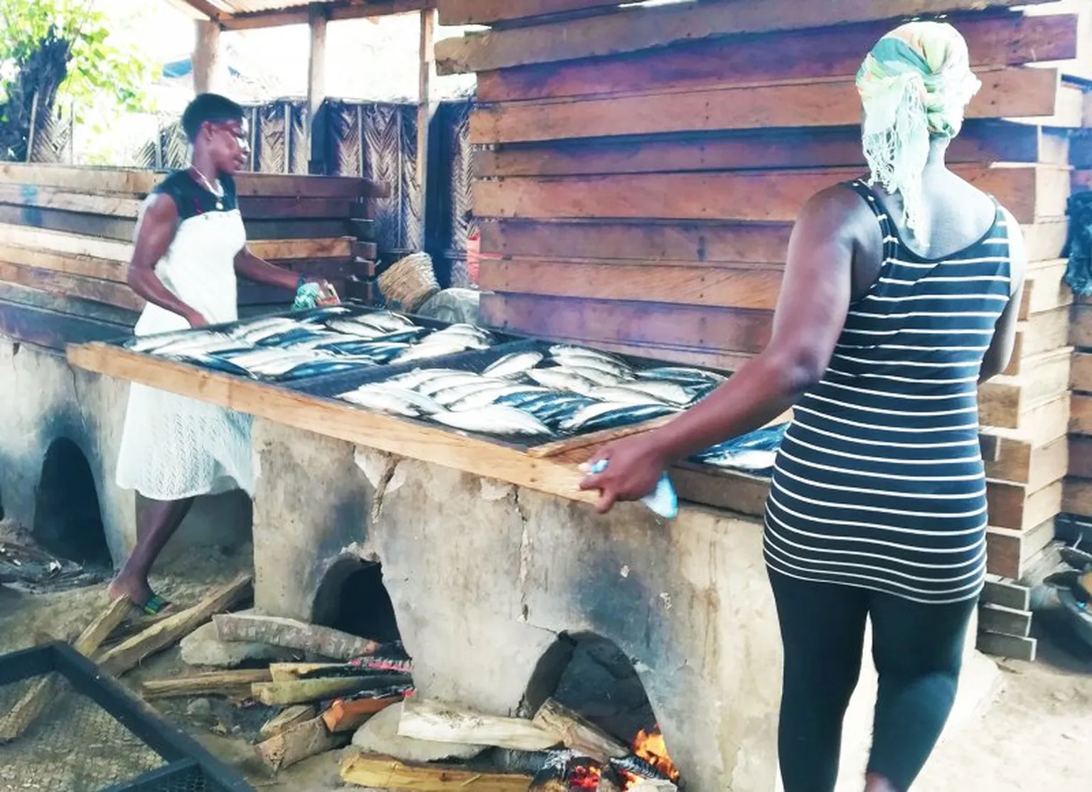 Women with traditional cookstoves 