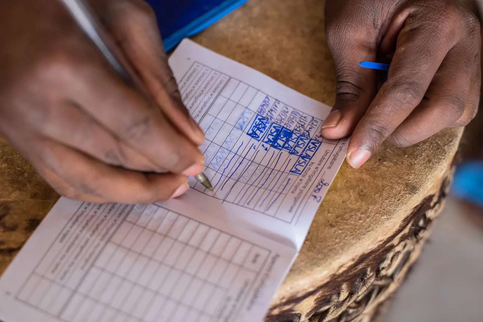 Filling out a booklet, keeping track of deposits and loans