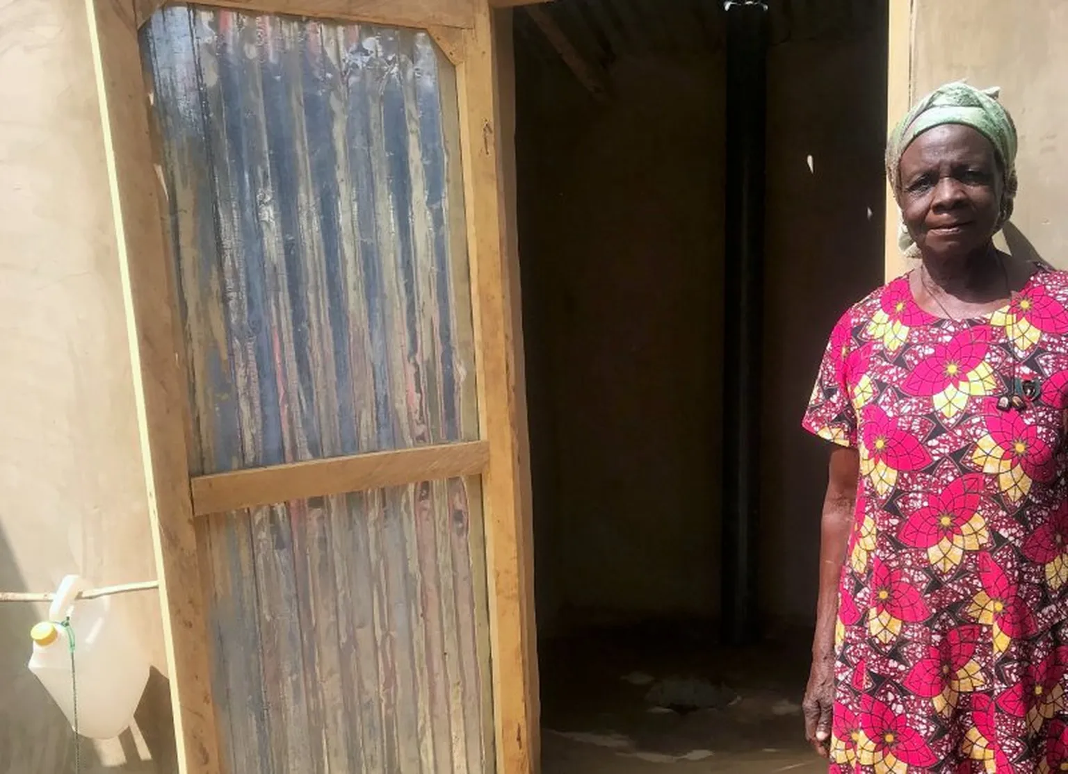 Catherine, from Nandom, poses in front of her toilet