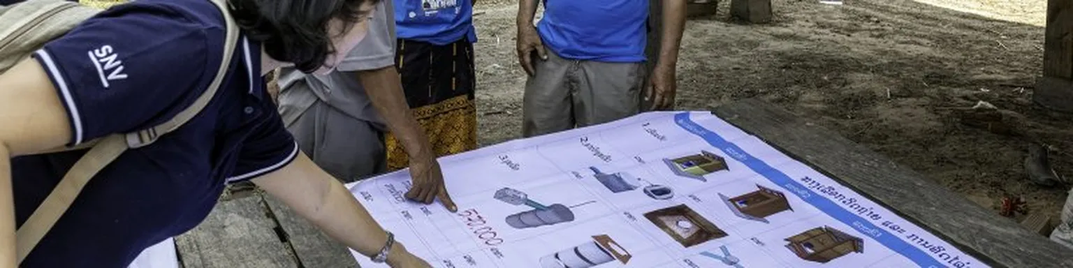 Lady pointing at infographic.