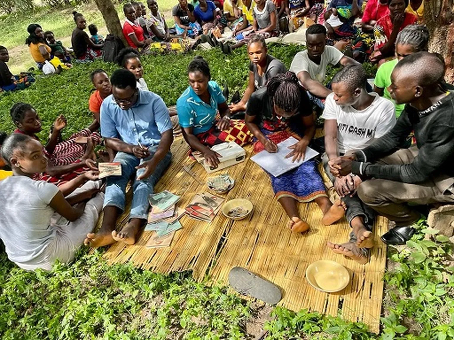 a group of youth at a savings and loans group meeting