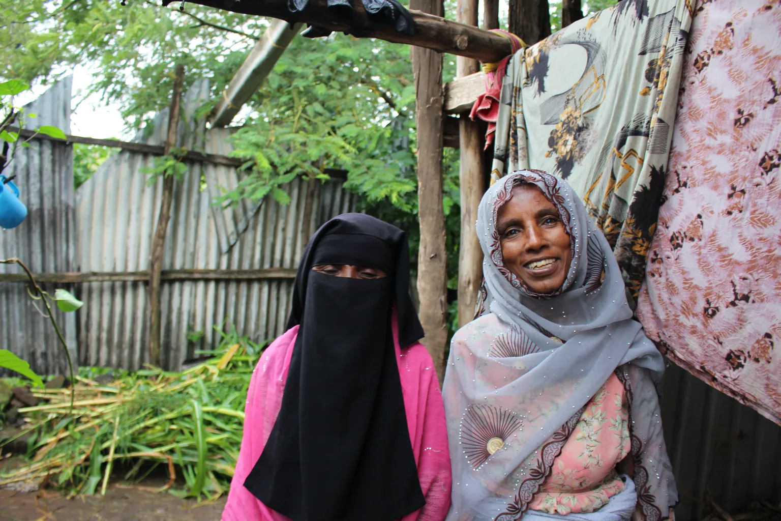 Zeritu and Zeyneba from the Amhara region are all smiles as they no longer need to draw water from unsafe sources, thanks to an SNV WASH project supported by USAID.