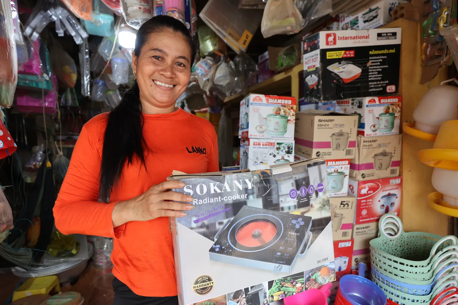 Woman holding a cookstove