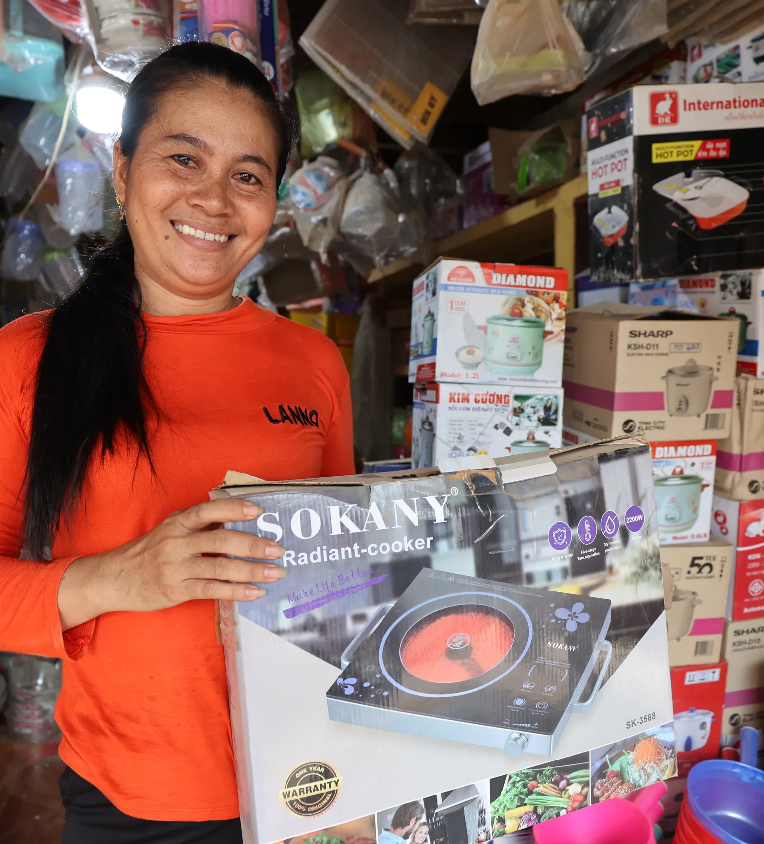 Woman holding a cookstove