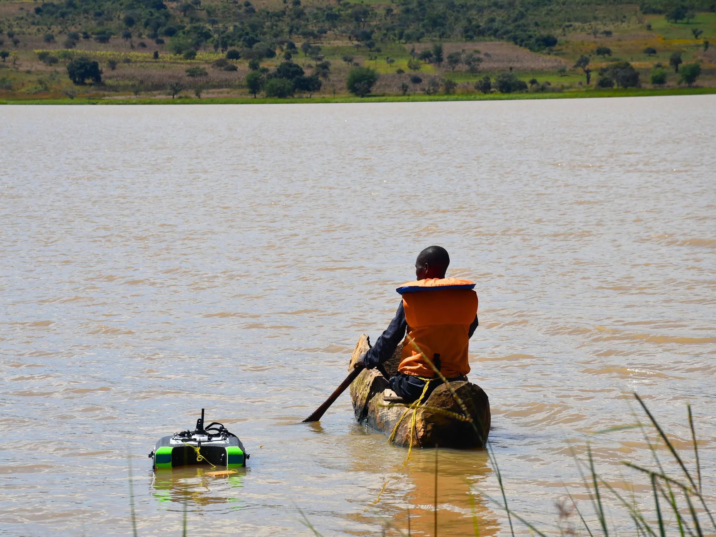 Trainee testing water quality in Katuma River
