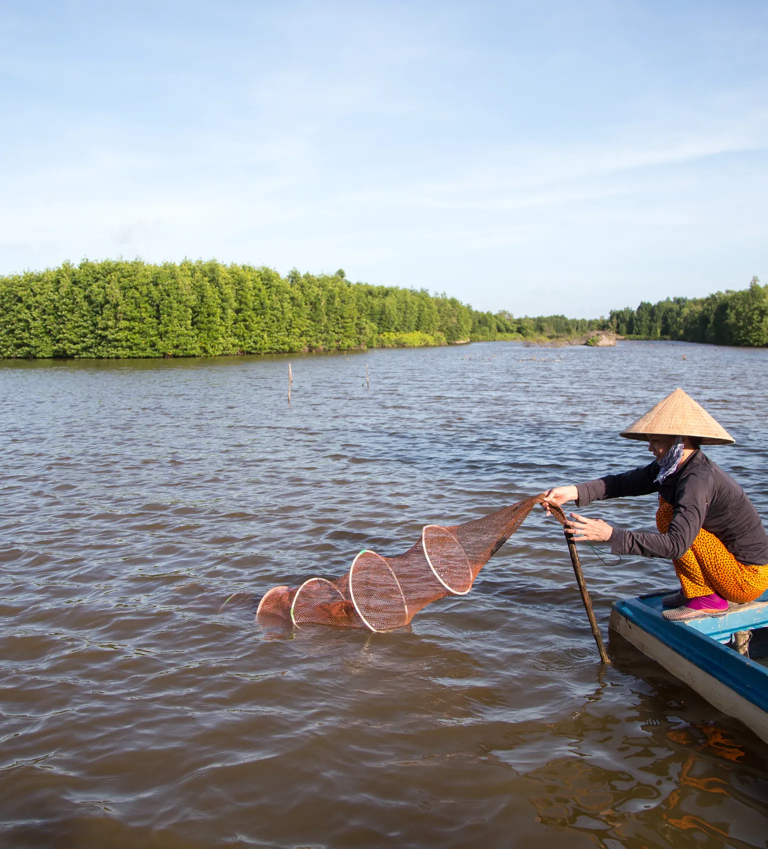 A woman engaged in shrimp farming in Ca Mau Vietnam, for Camimex in Vietnam with support from DFCD and SNV