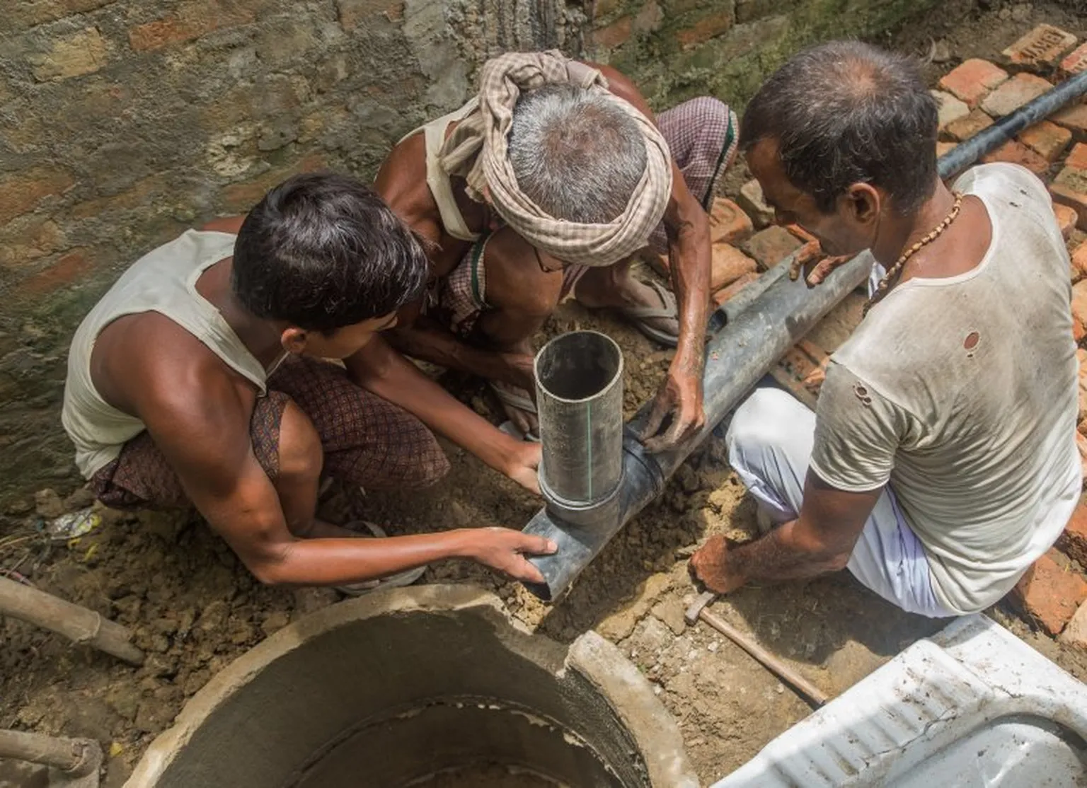 Toilet construction by masons and community members ongoing