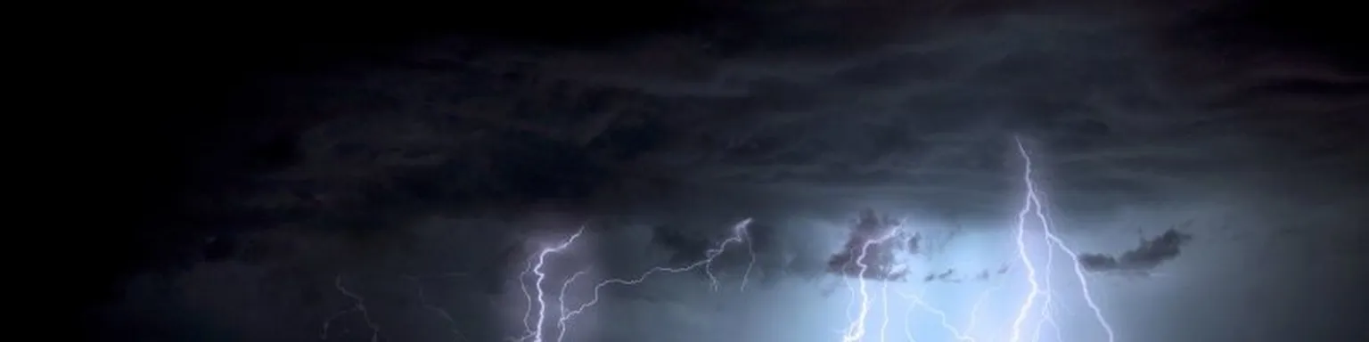 Lightnings coming down from a storm cloud.