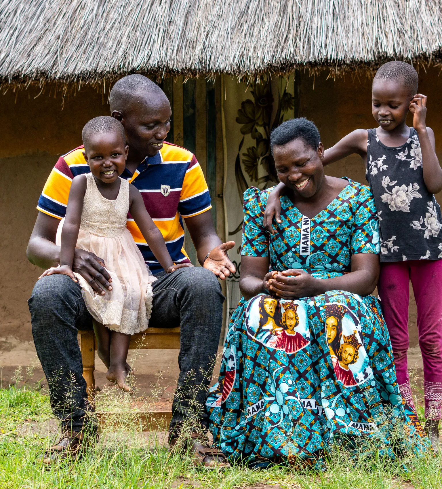 A sunflower farmer in Uganda with his family