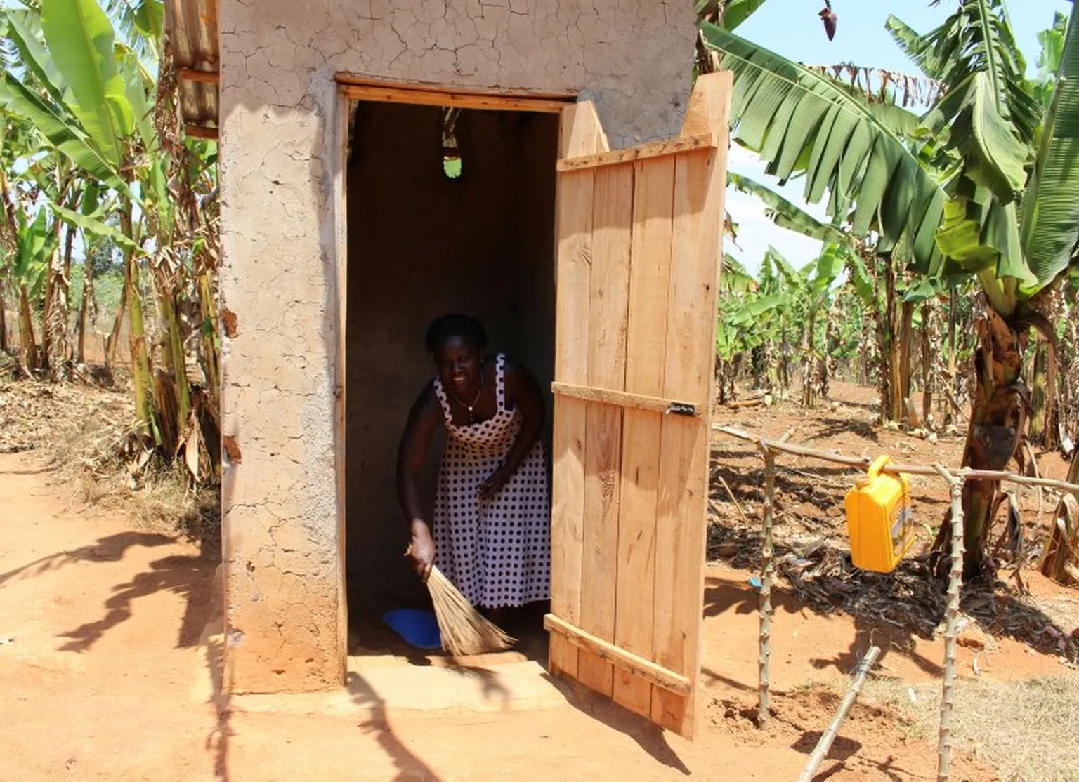 Charlotte cleaning the latrine.