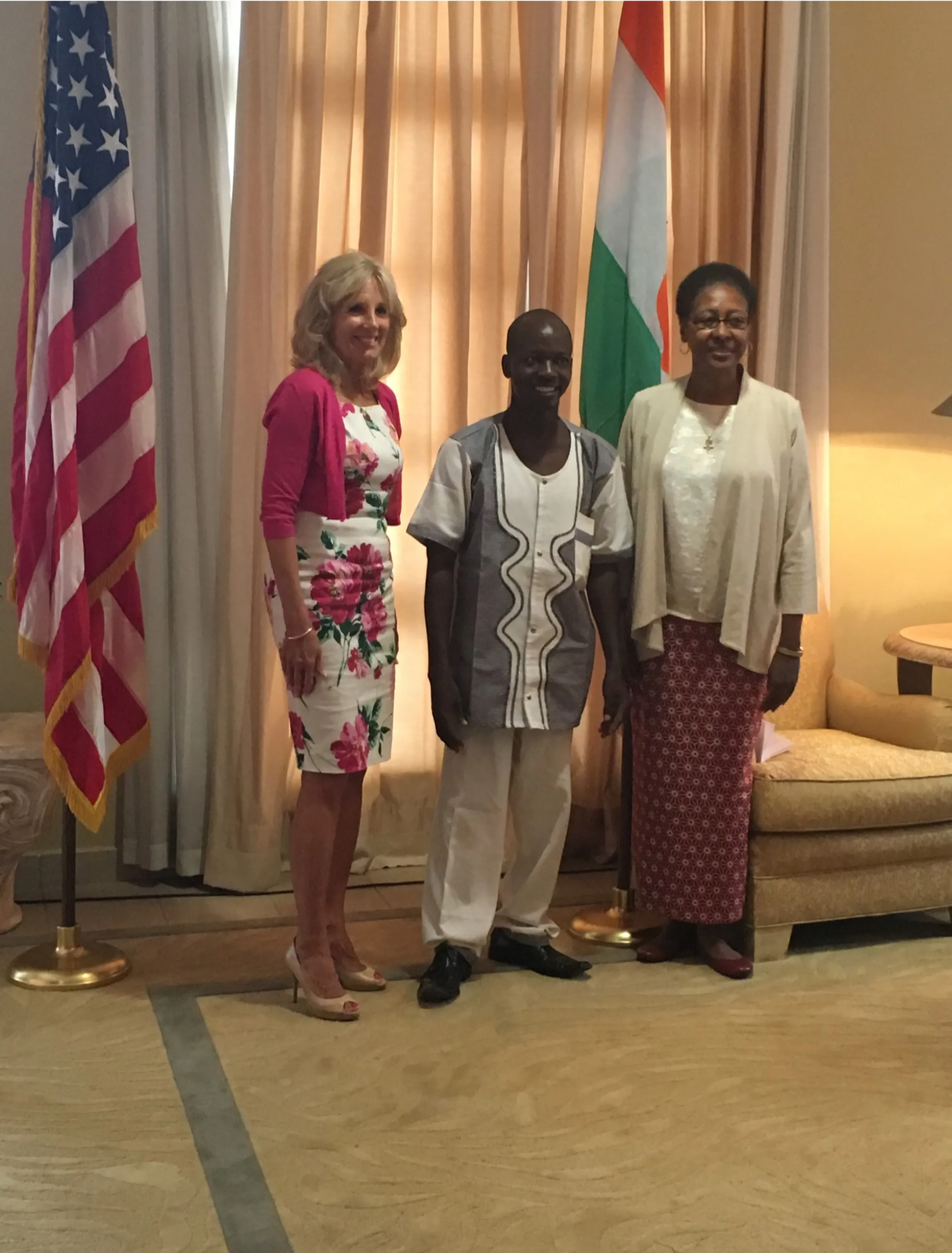 Dr. Biden and Ambassador Reddick greet YAWWA Trainer-of-Trainers Salifou Amadou