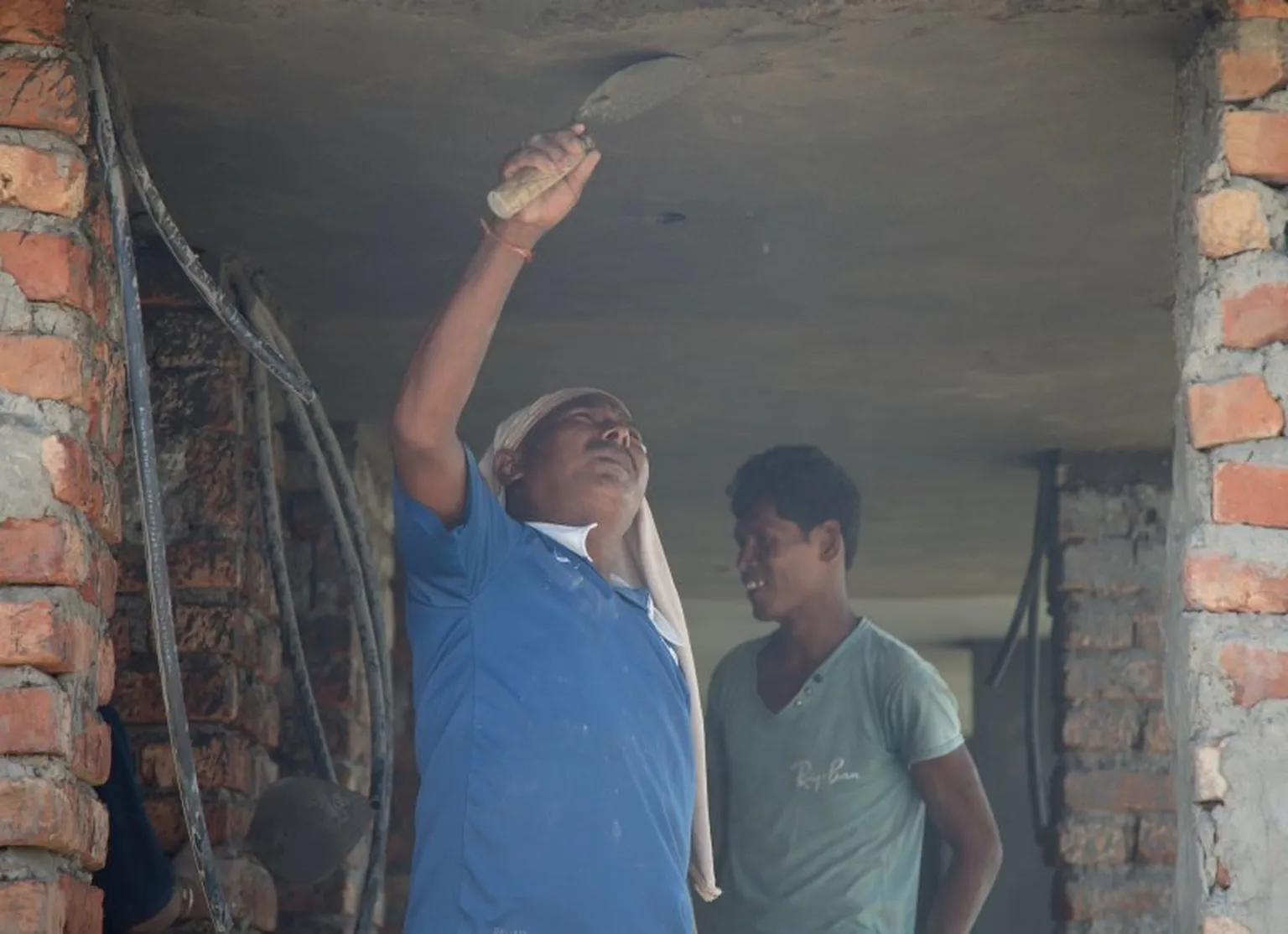 Man plastering roof