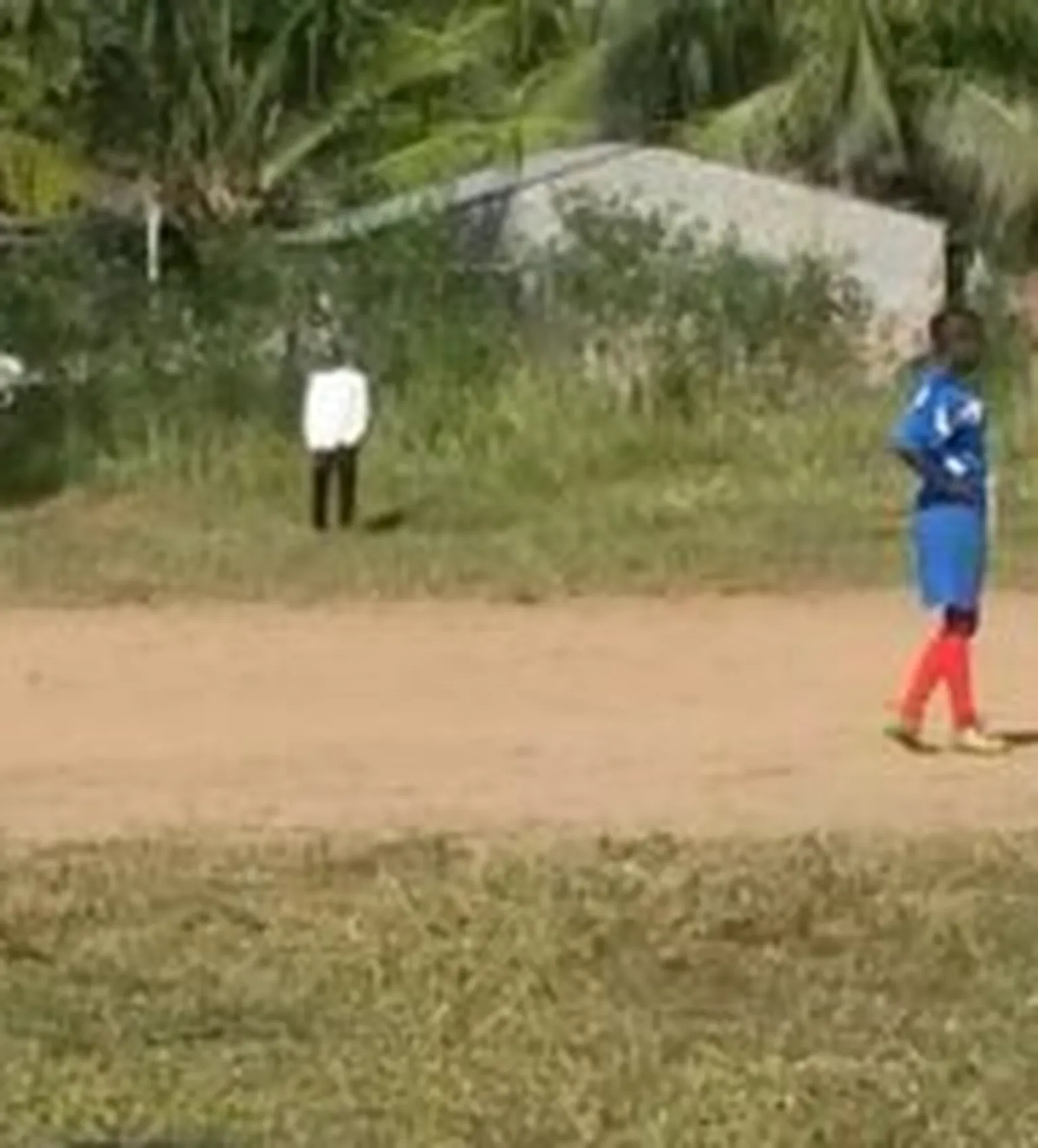 School children playing football.