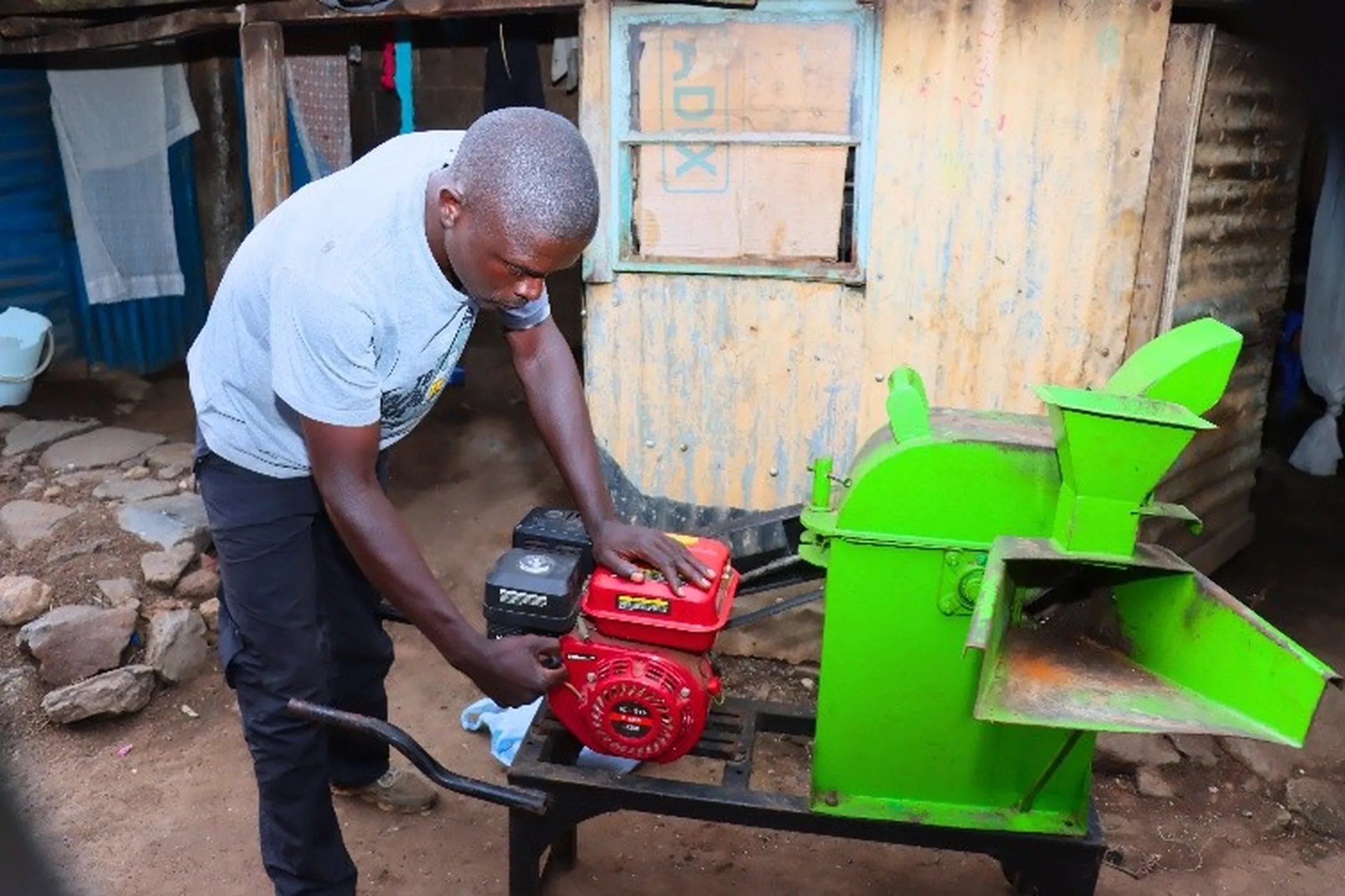 Duncan operating a mini feed milling machine