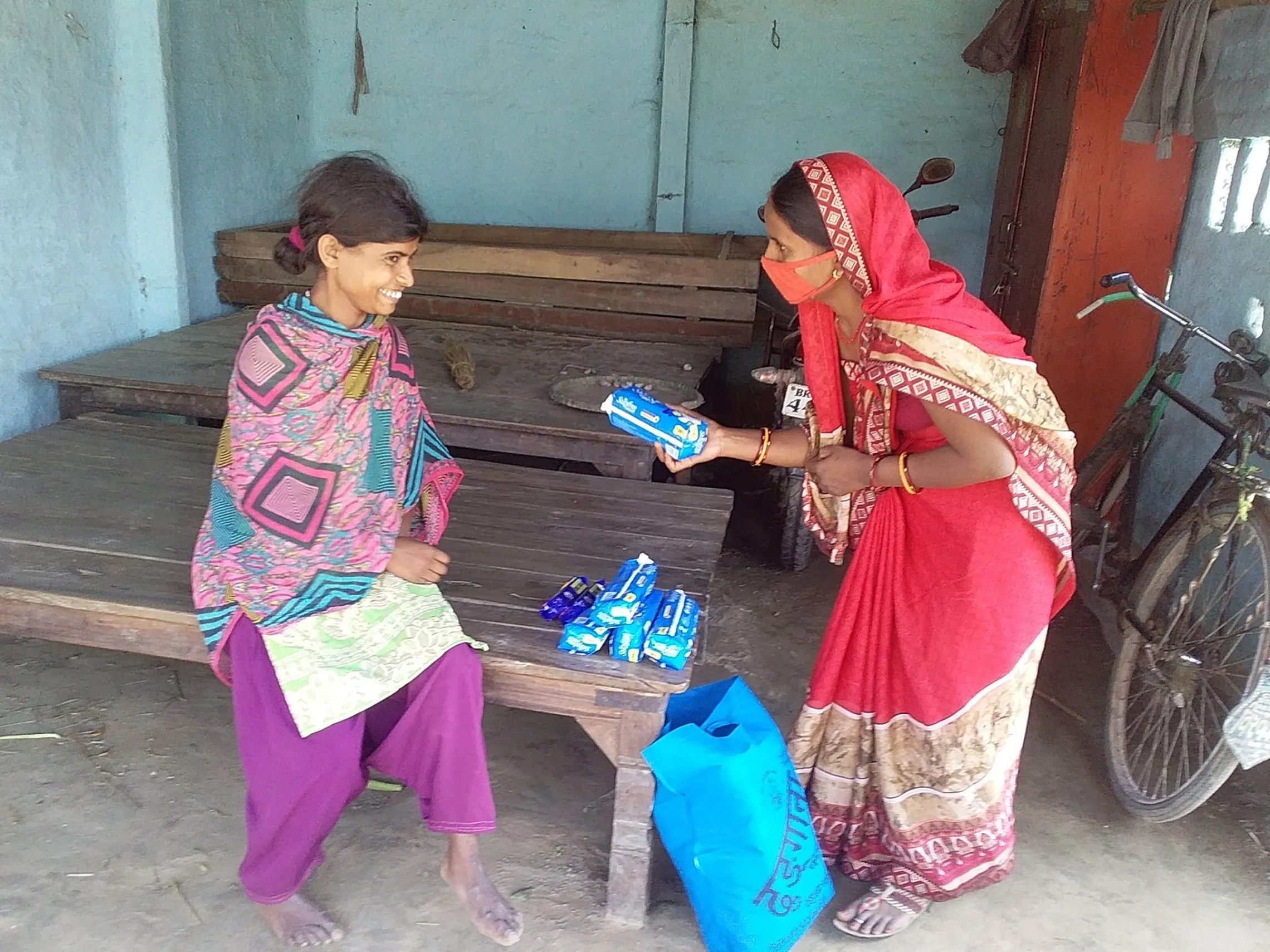 Woman with disability is counselled on the use of sanitary pads