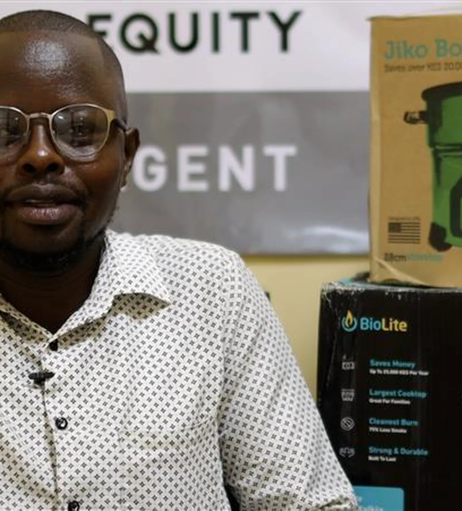 Stephene in Kenya posing for a photo next to a clean cooker