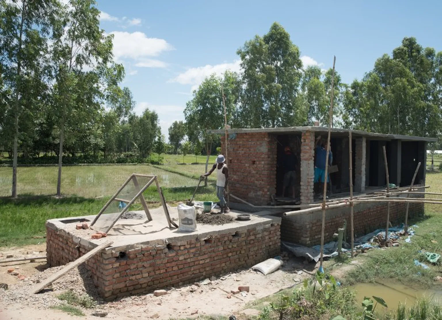 Man working on constructing a house