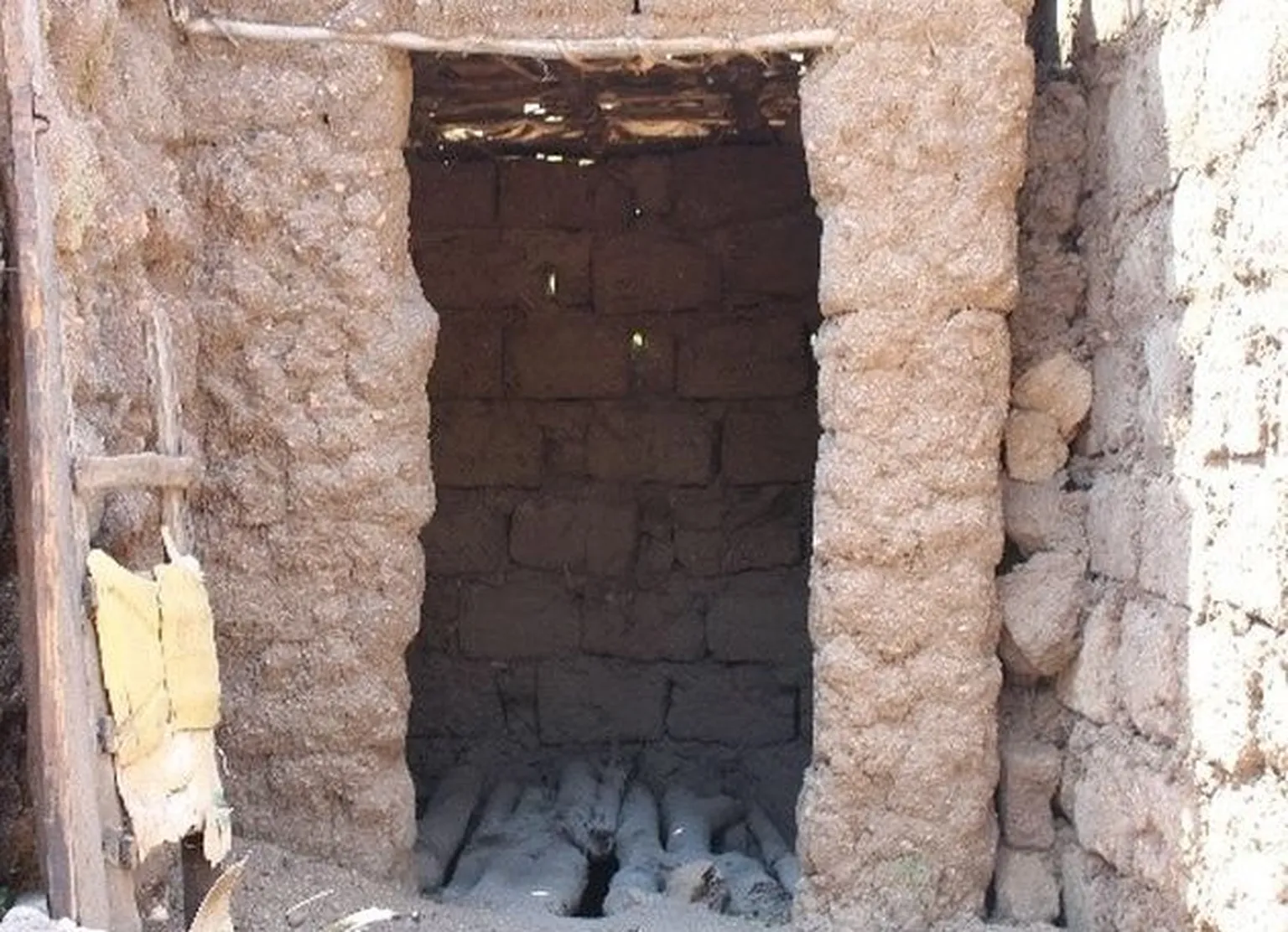 Ms. Nyiranyezimana’s old un-improved latrine