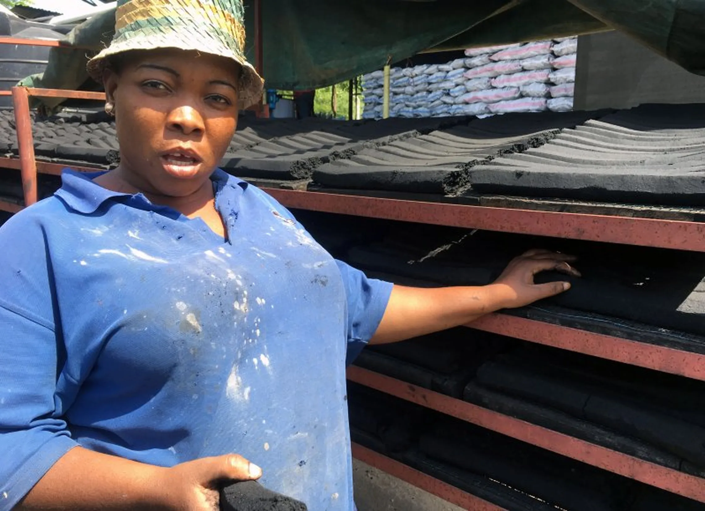 Joyce with manufactured briquettes