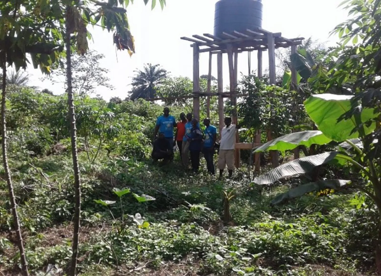 The team under the constructed water tank