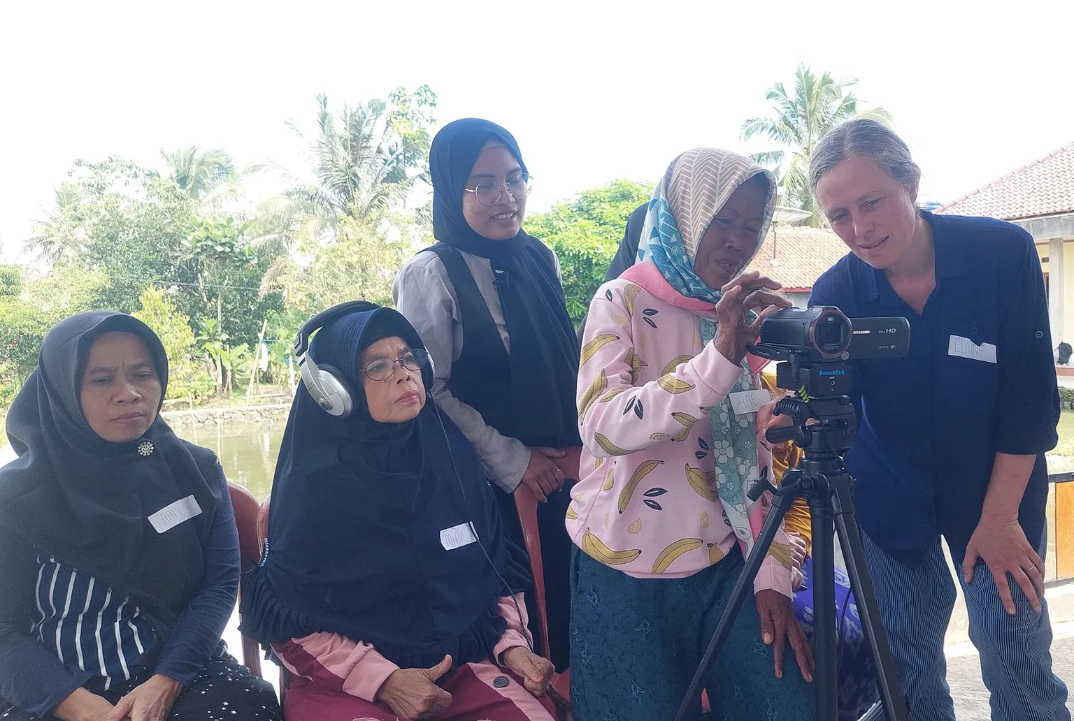 Older women partners of SNV in Indonesia participate in an SLTH sanitation video 