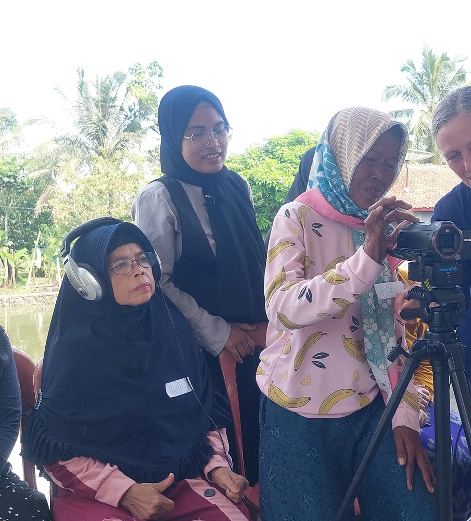 Older women partners of SNV in Indonesia participate in an SLTH sanitation video 