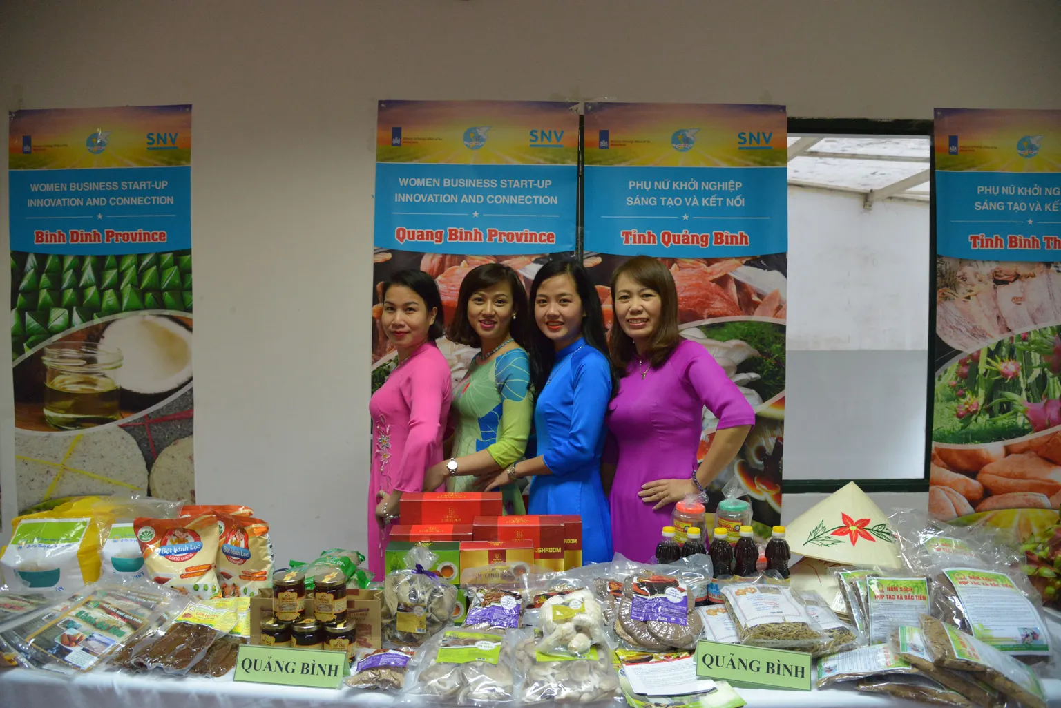 four Vietnameze women showcasing their products