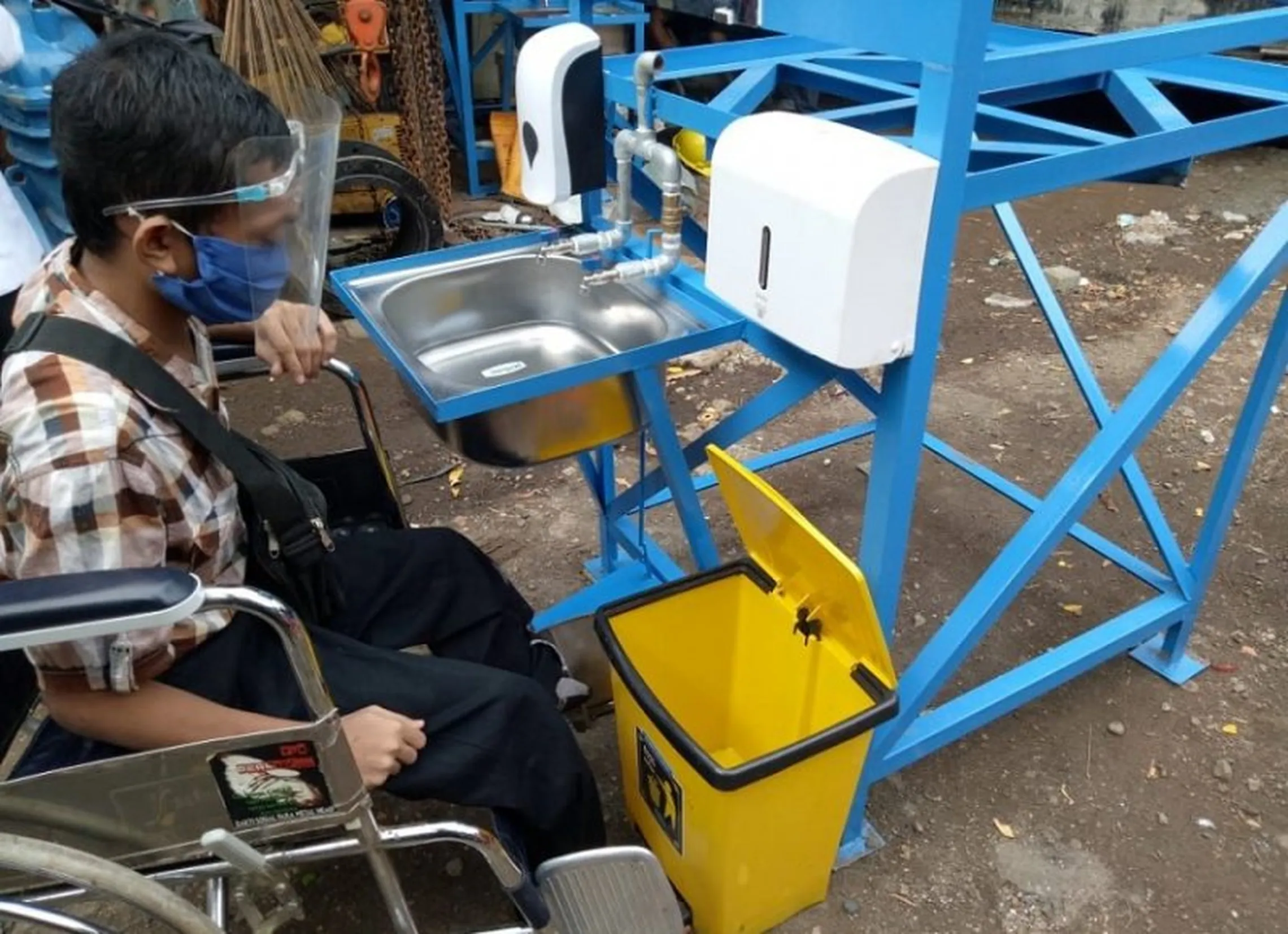 Handwashing station being tested for wheelchair accessibility