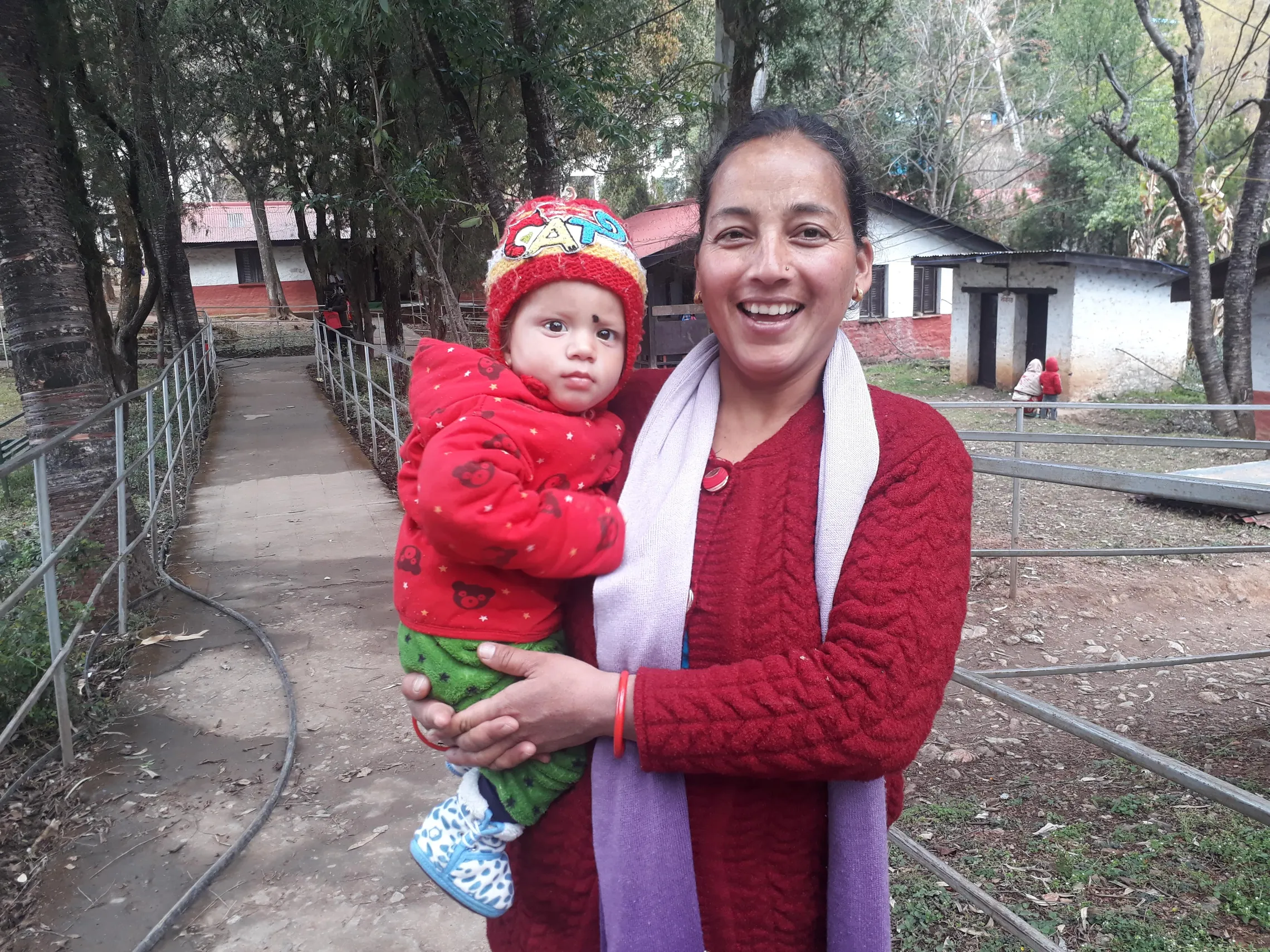 Laxmi Khadka Oli with her 13-month-old child