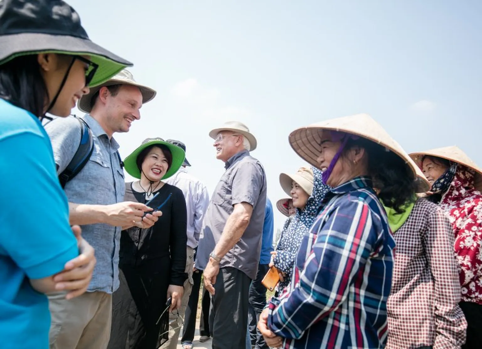 Group of people meeting a field