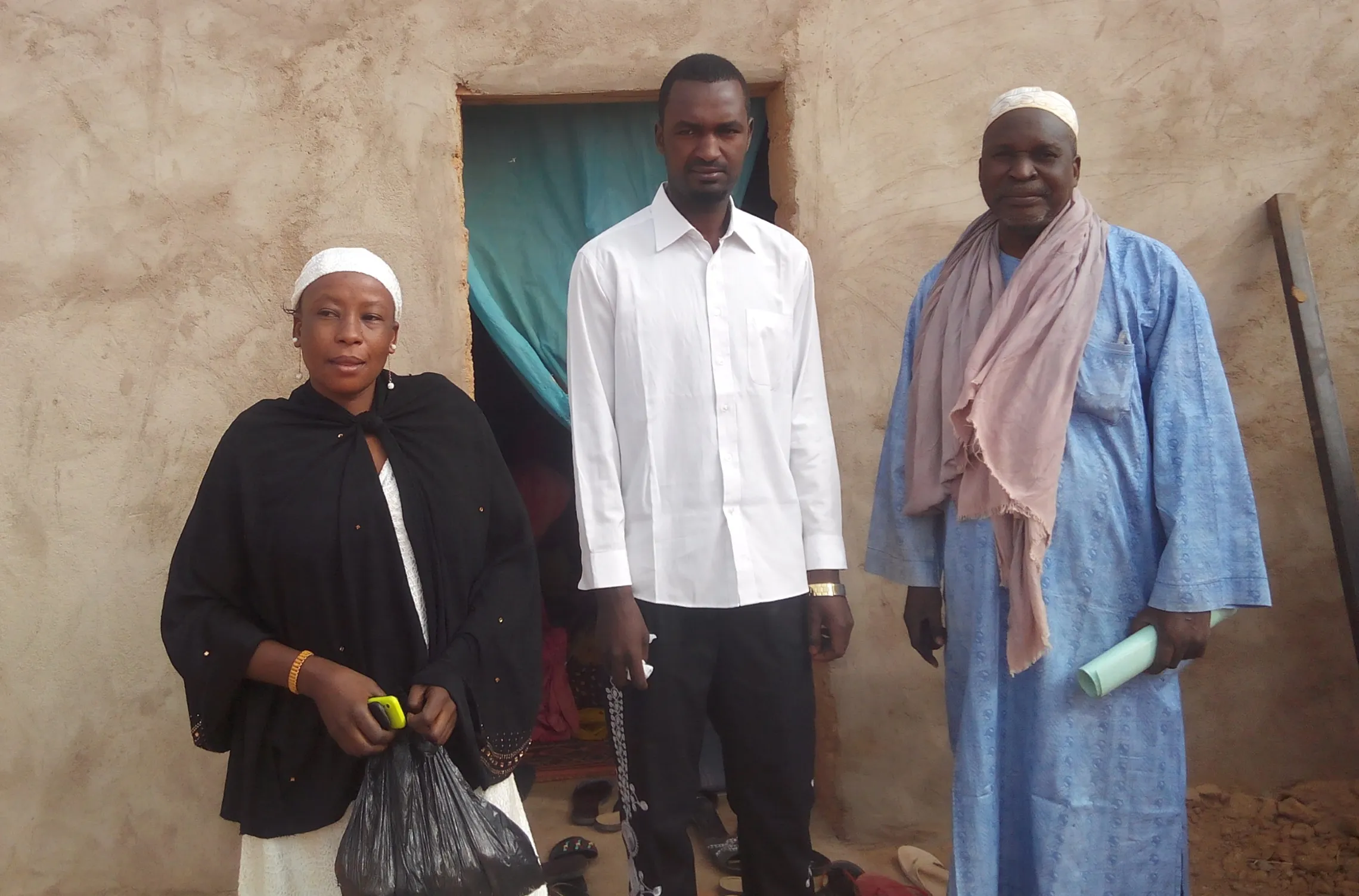 Roumanantou with YAWWA trainers in front of the newly constructed Foyer Tadress