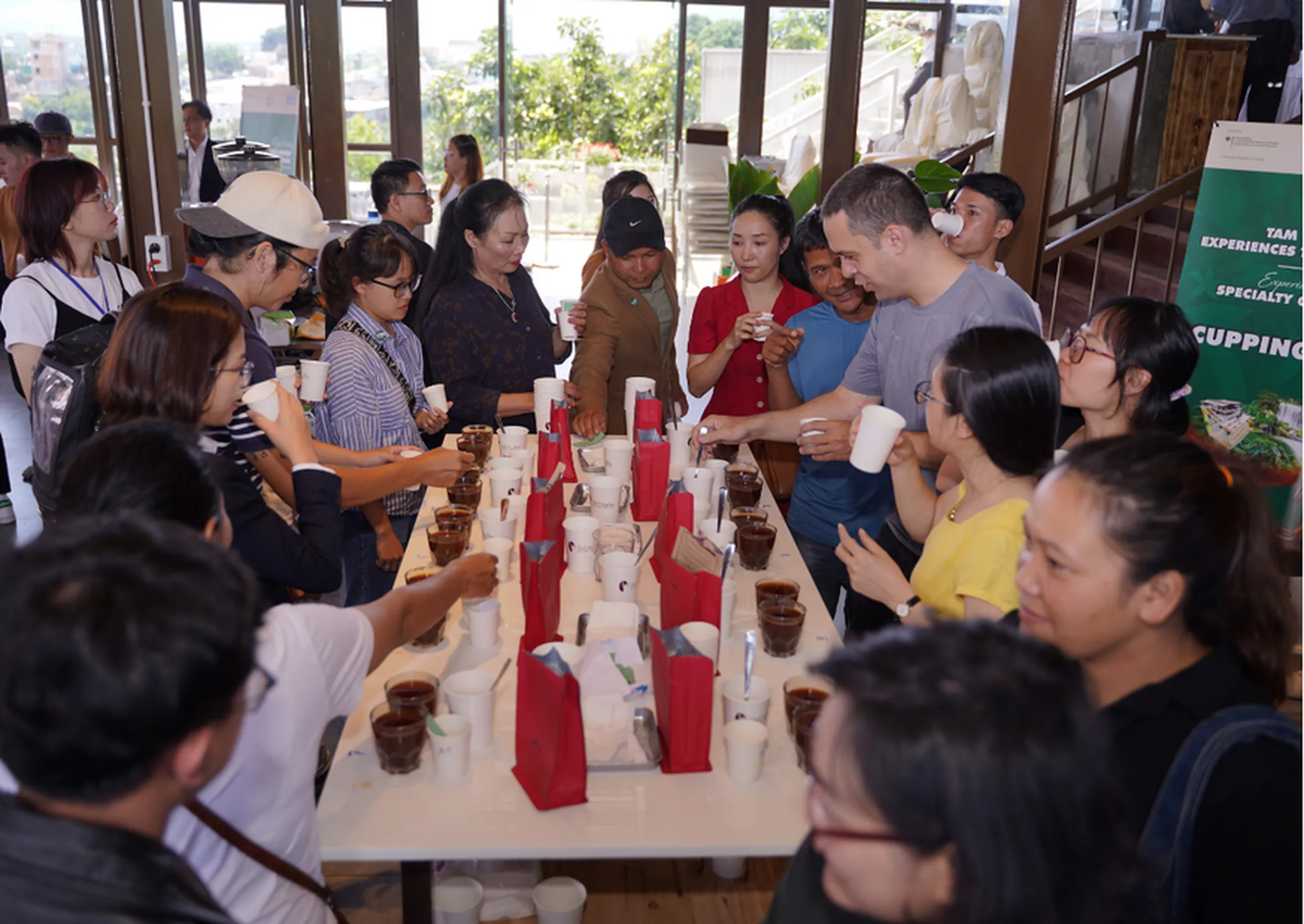 People around a table tasting coffee