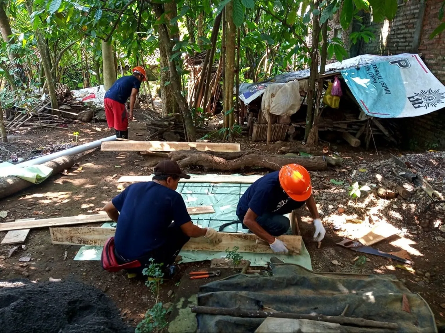 Masons in Indonesia during an SNV-led practical workshop on septic tank installation