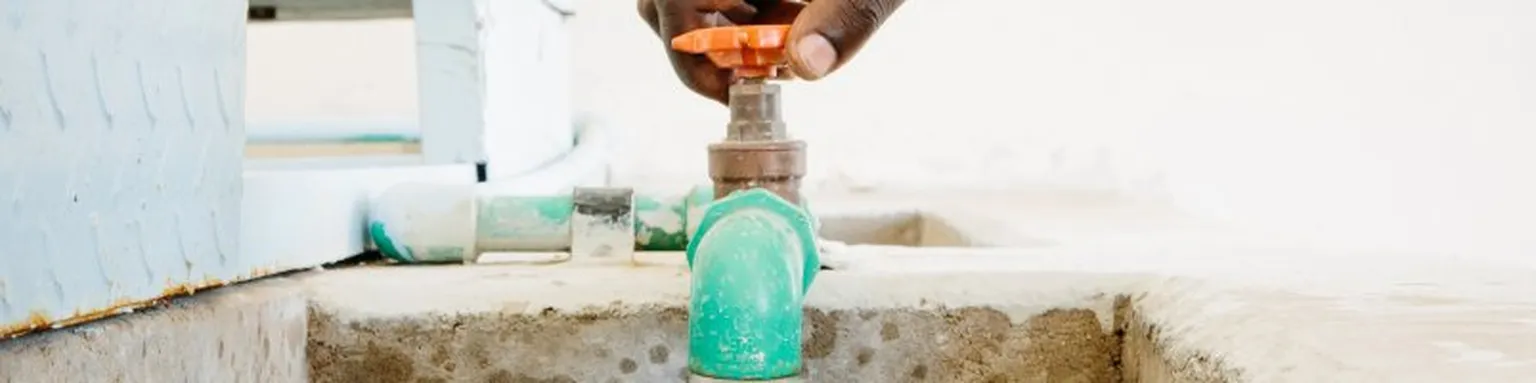 Water tap being turned.