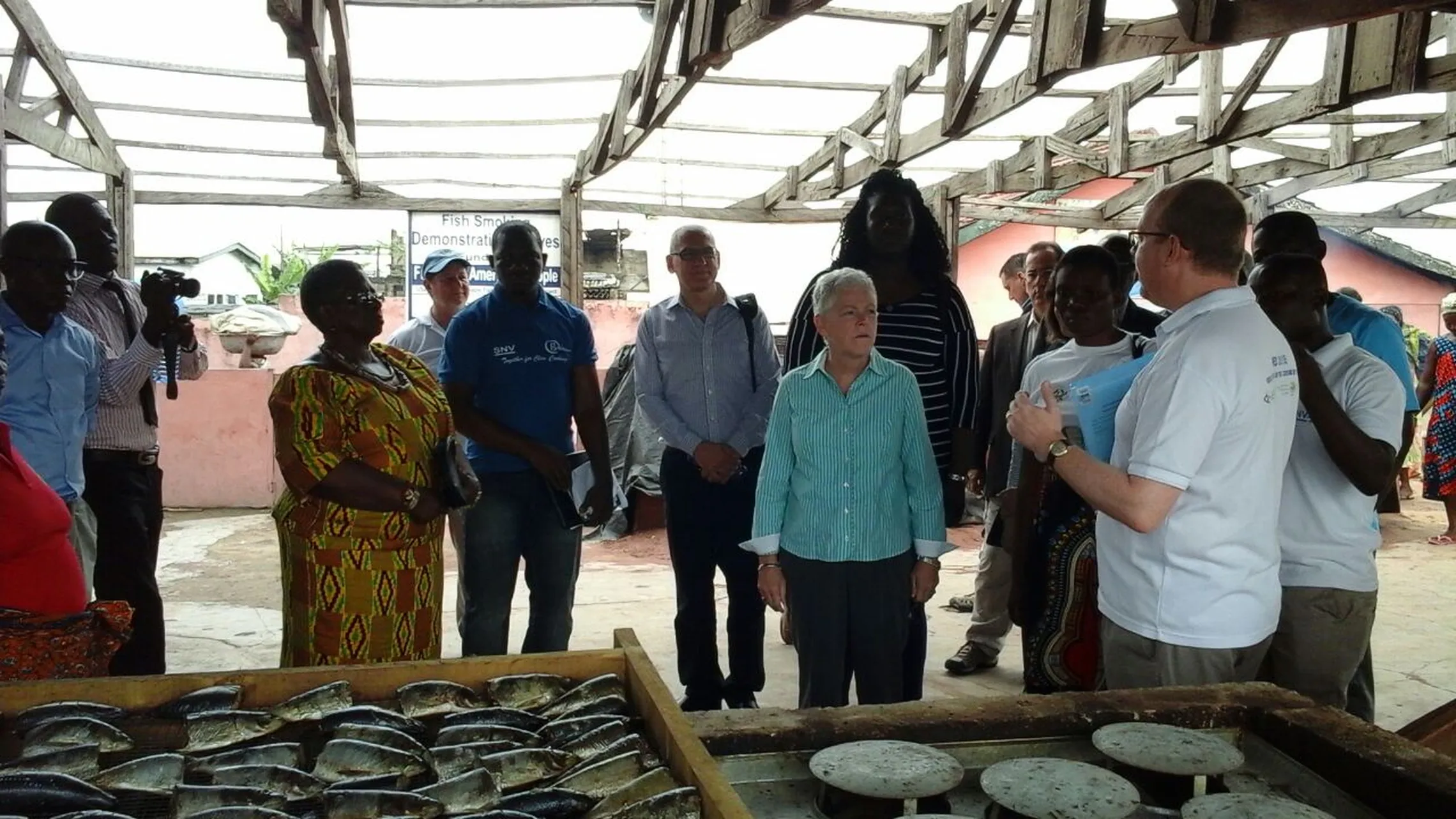 Administrator Gina McCarthy observing the Ahotor fish demonstration stove