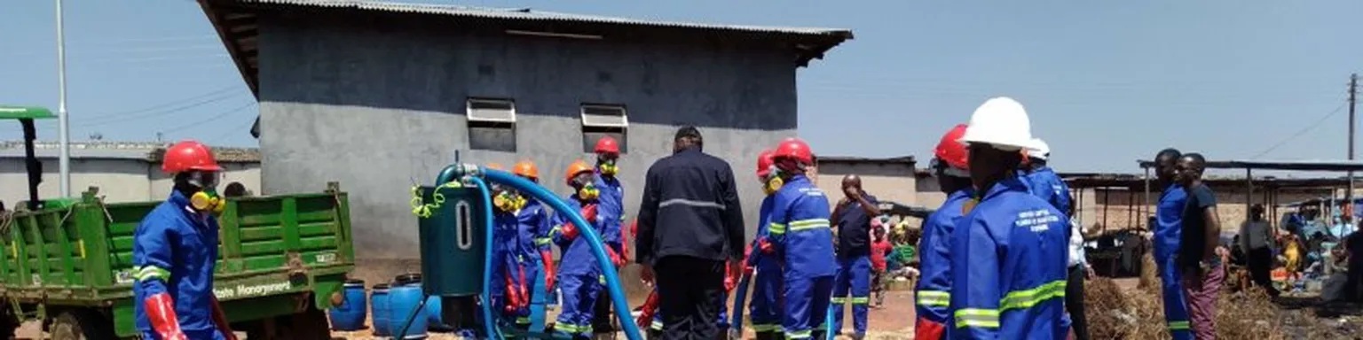 Group of men building sanitation facility