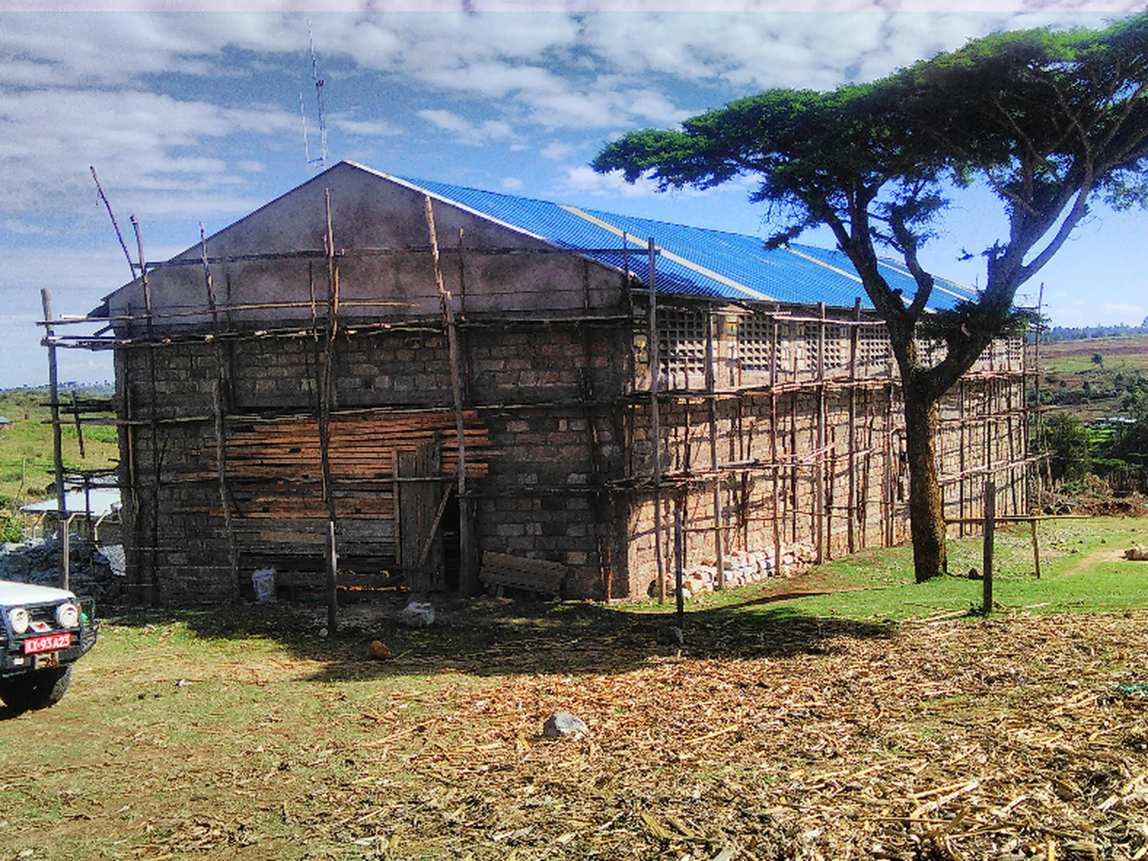 wooden building with blue roof