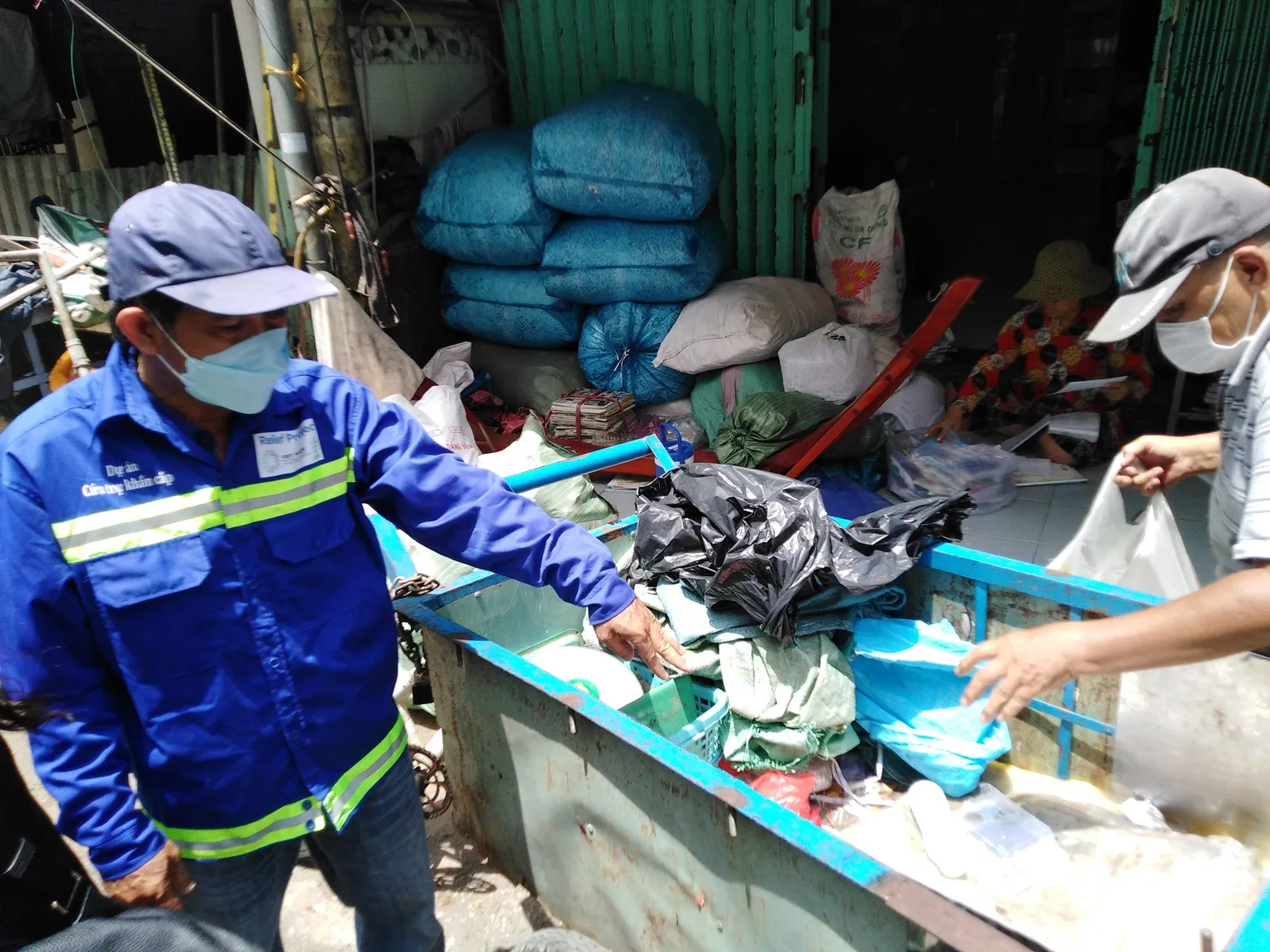 People sorting through waste to sell 