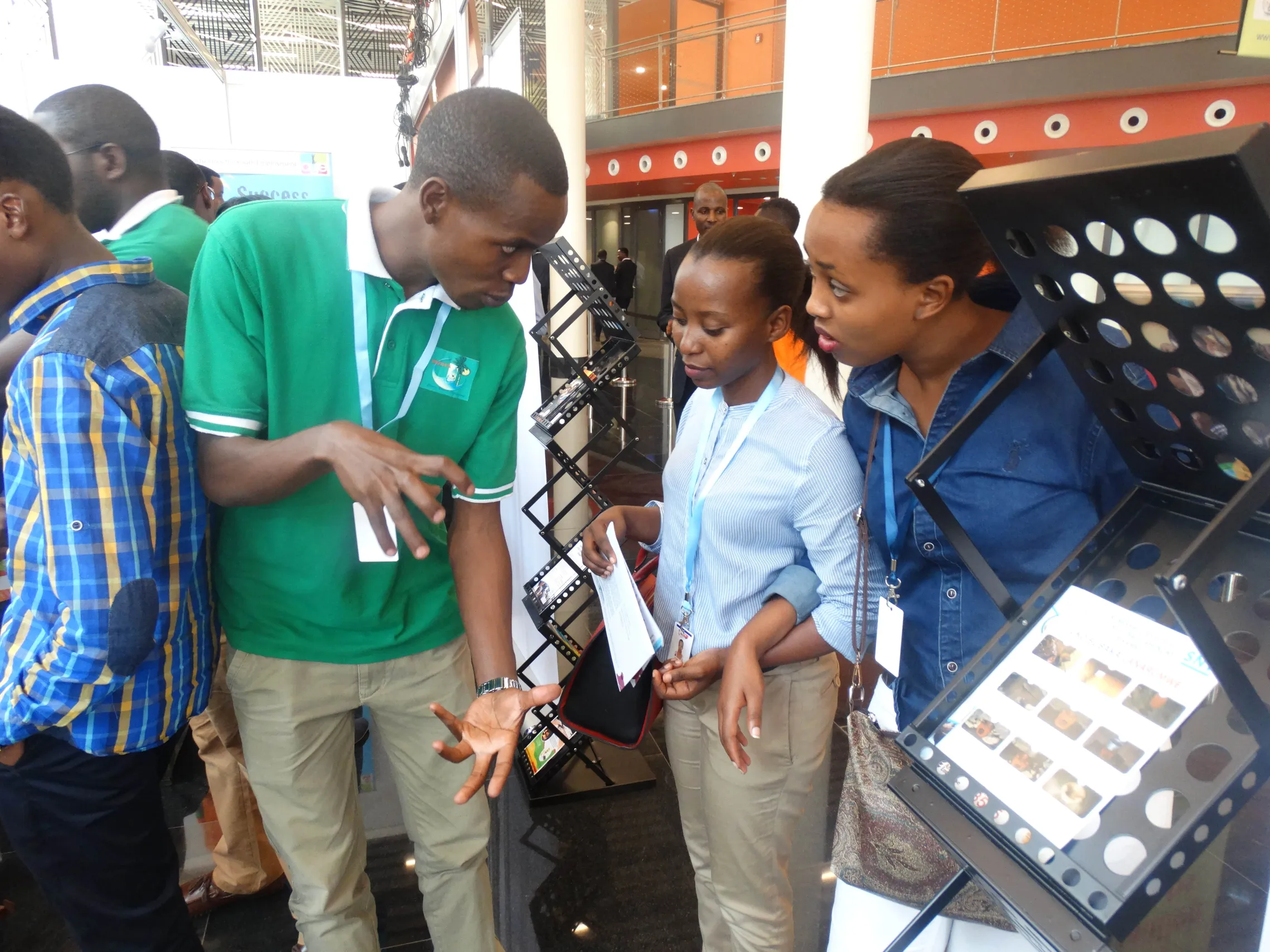 Vedaste Hagerimana explaining how a bio-digester is installed