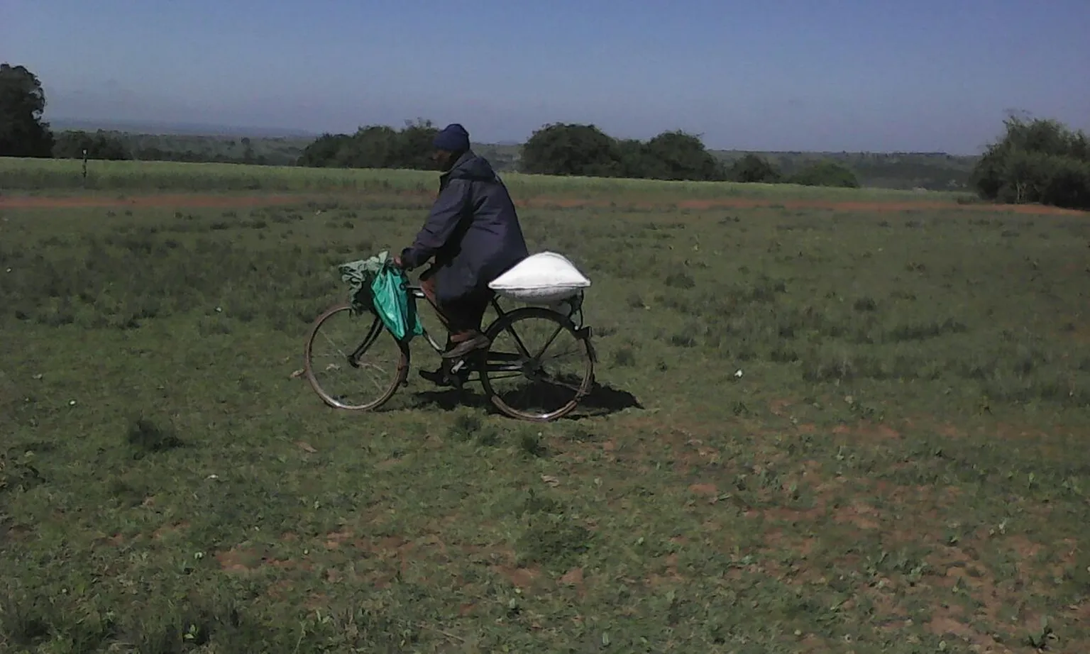 Mike goes to the posho mill, which was done by his wife before our intervention