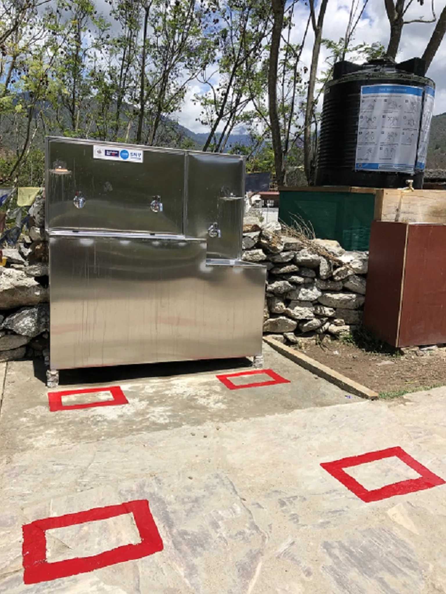 Distance markers placed to avoid crowding in handwashing station