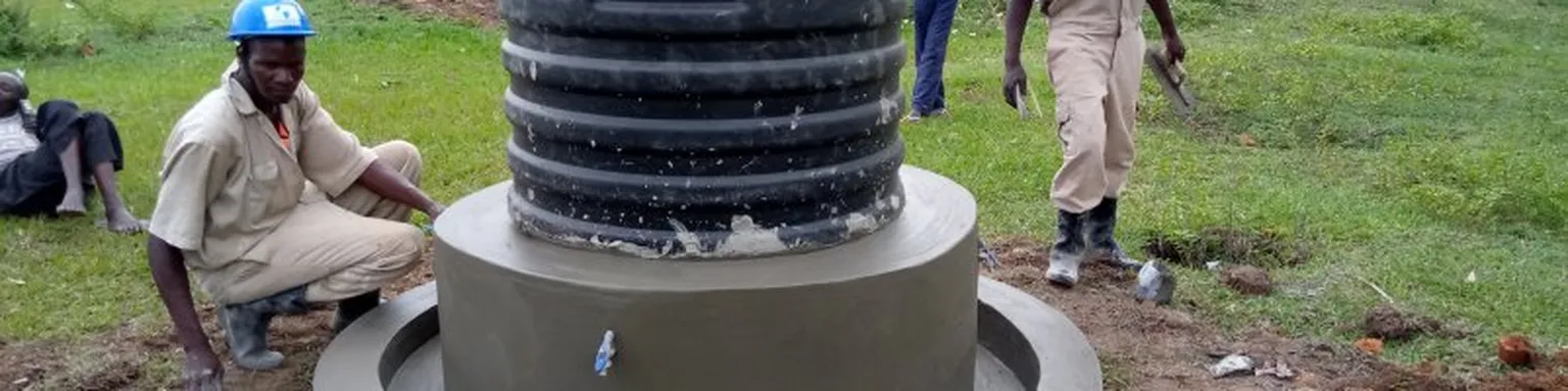 Picture of man building a well